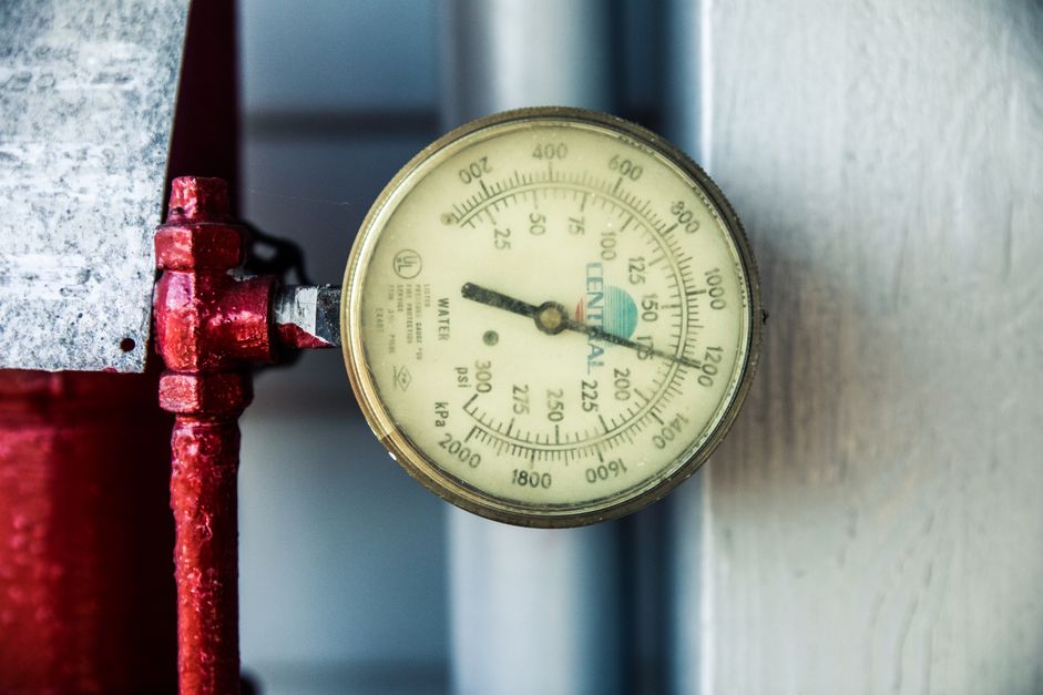 Close-up of a water pressure gauge and meter