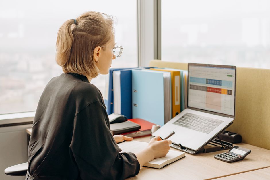 Spreadsheet open on a laptop screen at a desk