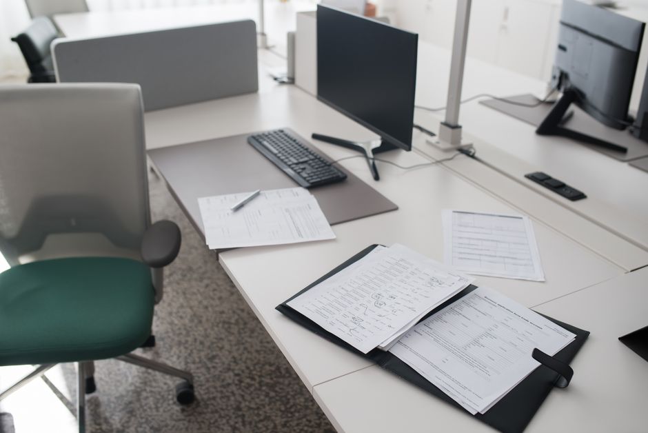 Empty office desk left behind after an employee departure